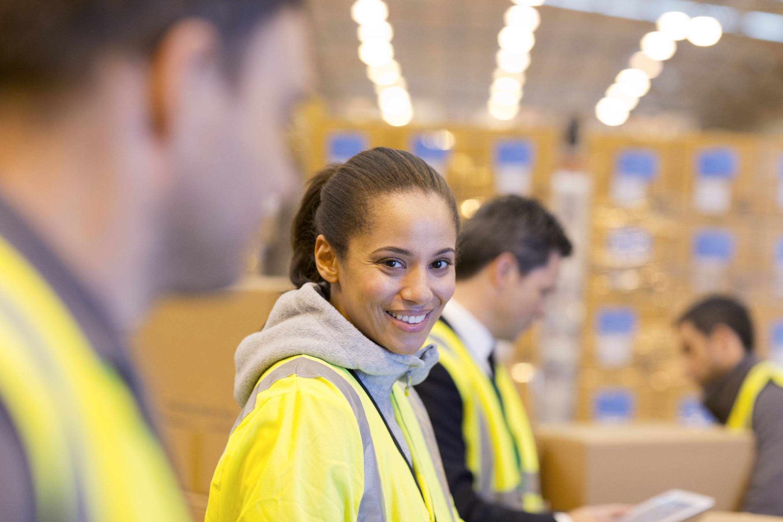 Worker smiling in warehouse Worker smiling in warehouse