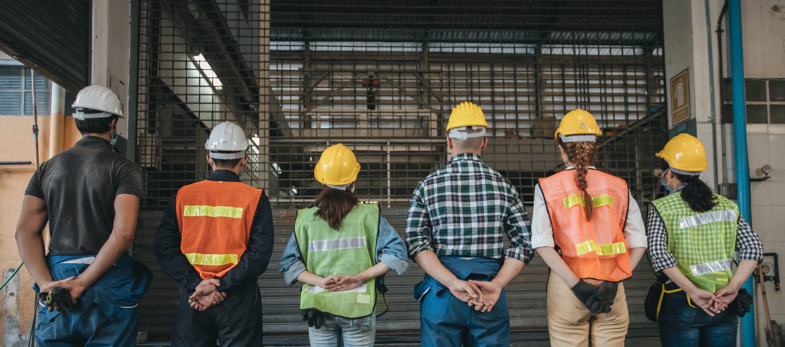group of industrial worker wearing protective in factory. view f